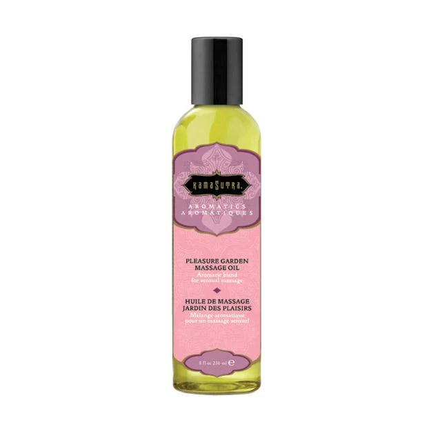 Kama Sutra Pleasure Garden massage oil in a clear bottle with a pink label.