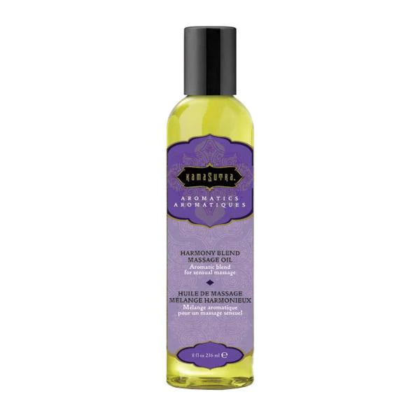 Kama Sutra Harmony Blend massage oil in a clear bottle with a purple label.