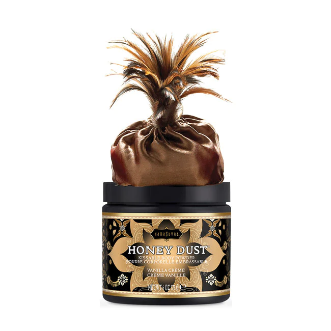 Vanilla Crème Honey Dust body powder with a feather applicator.