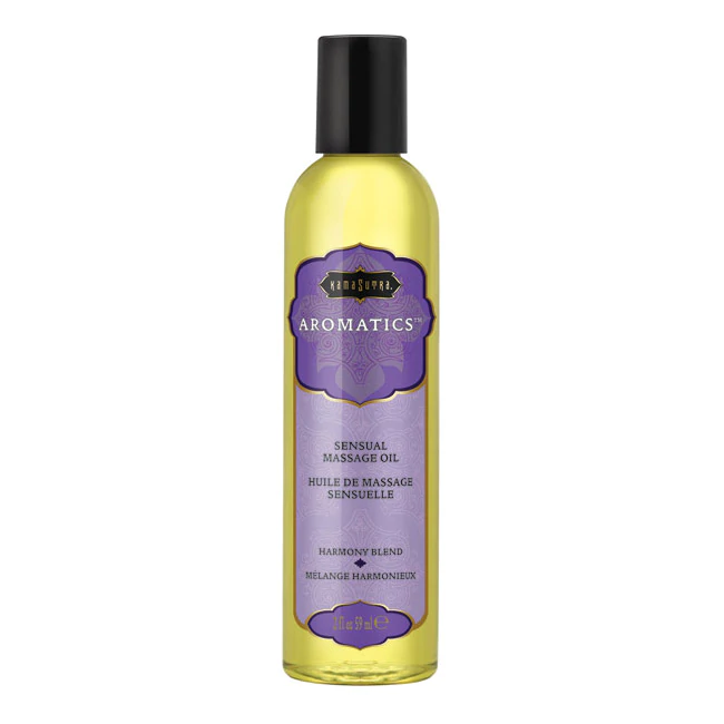 Kama Sutra Aromatics massage oil in a clear bottle with a purple label.