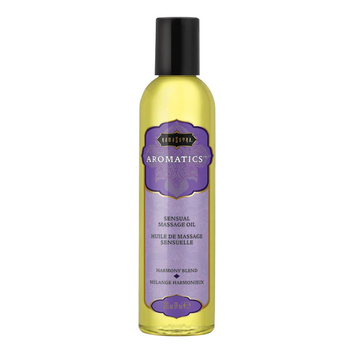 Kama Sutra Aromatics massage oil in a clear bottle with a purple label.