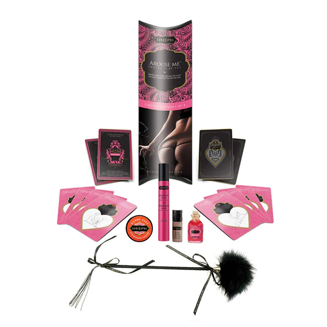 Erotic playset with feather tickler, Kama Sutra cards, and sensual body products.