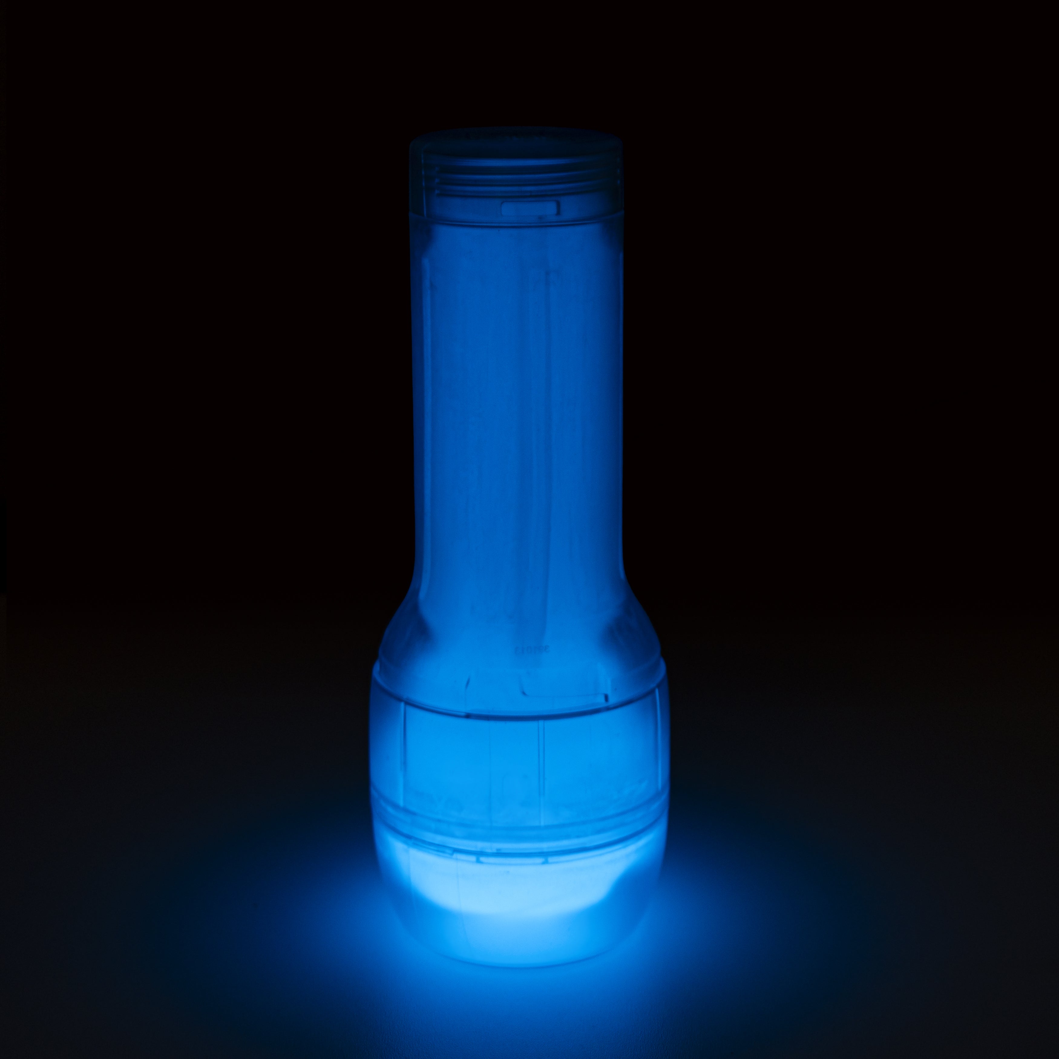 A blue glow-in-the-dark stroker with a textured sleeve.