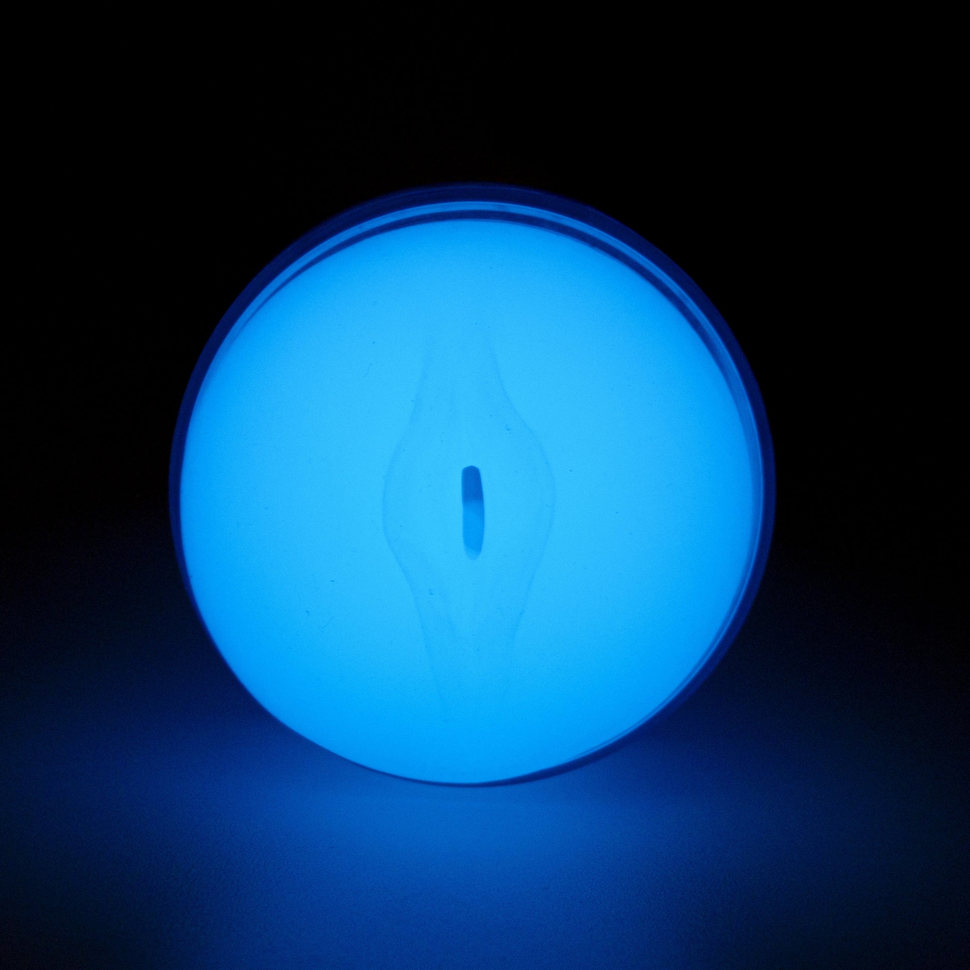 A blue glow-in-the-dark stroker with a textured sleeve.