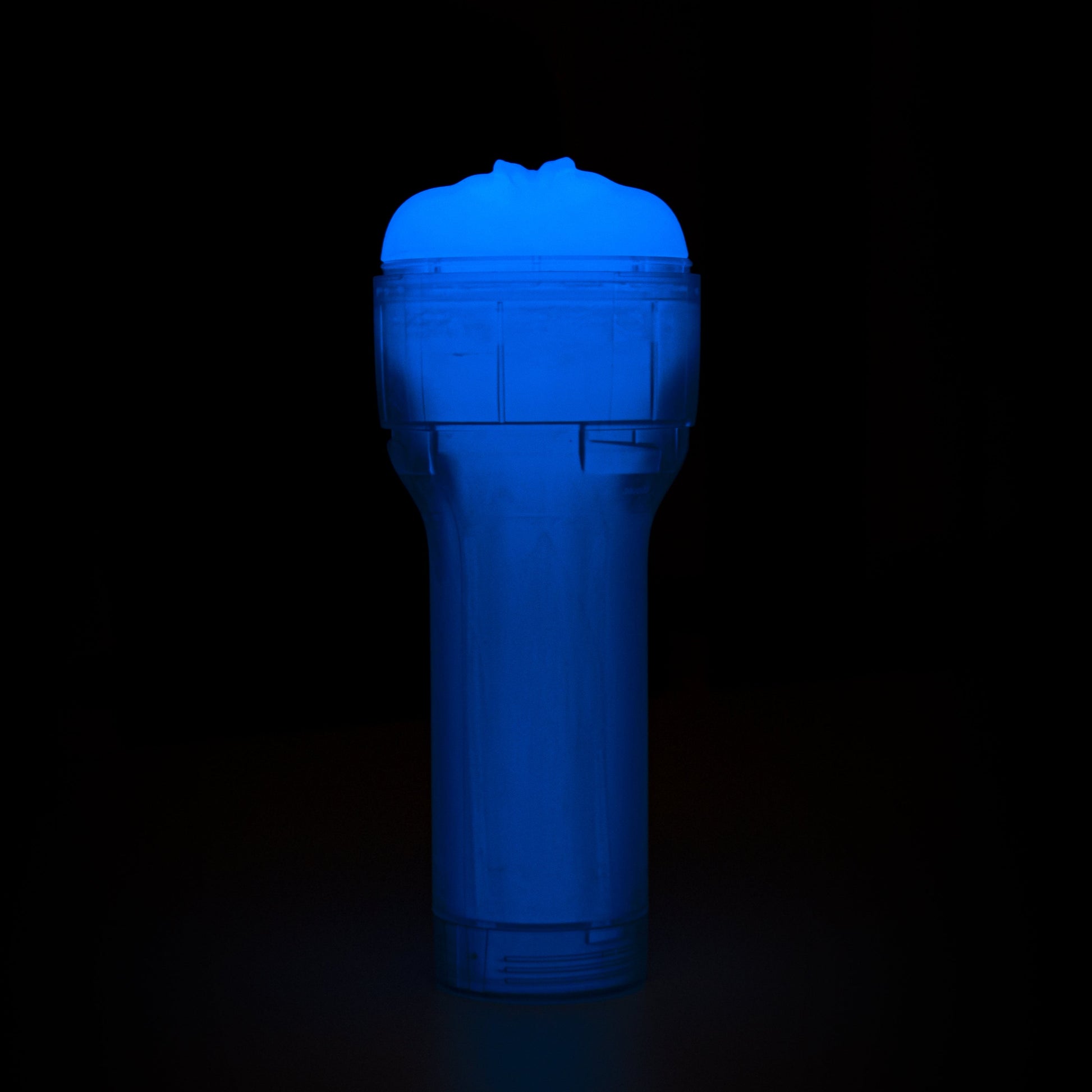 A blue glow-in-the-dark stroker with a textured sleeve.