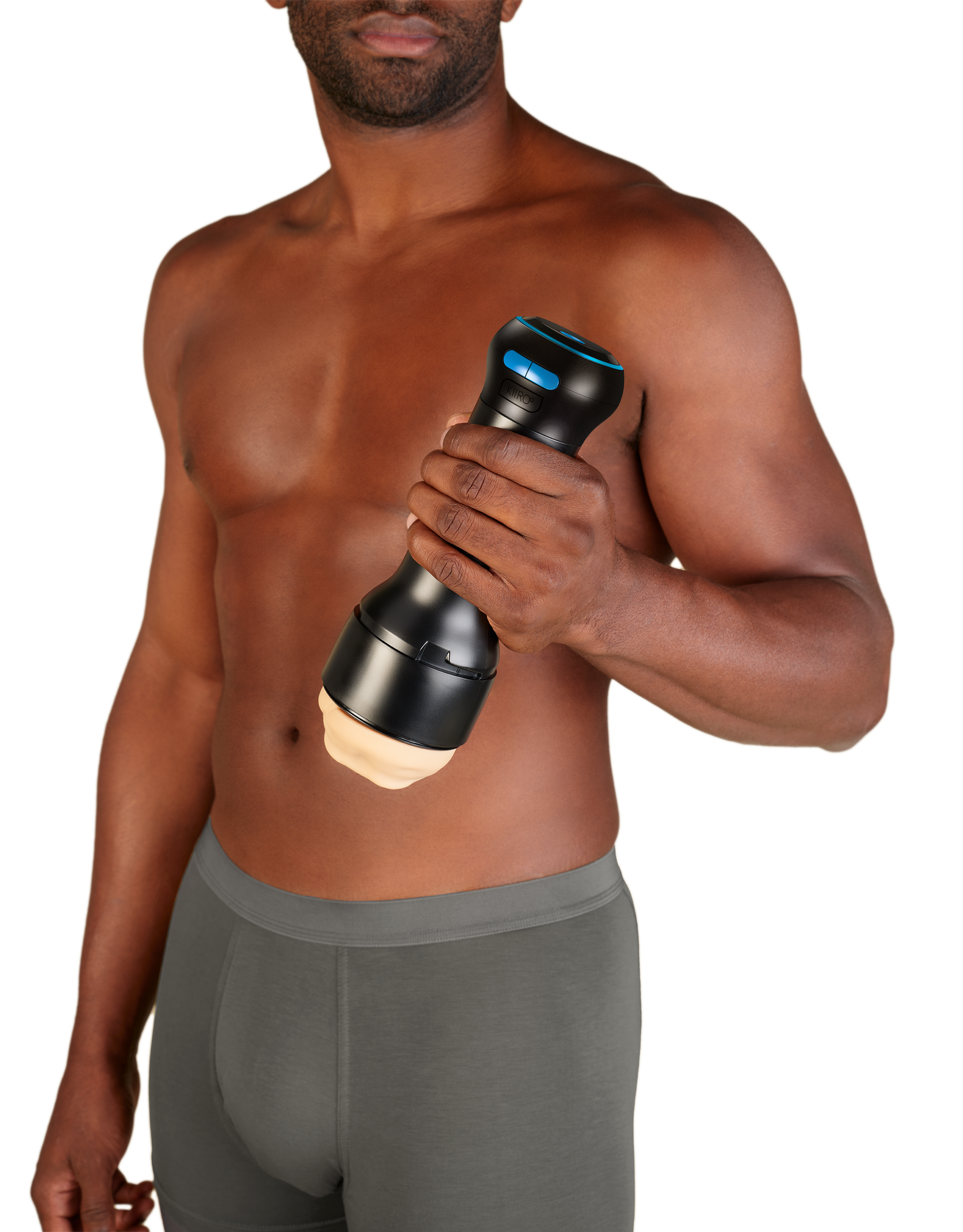 A man holds a black Kiiroo stroker controller with blue buttons.