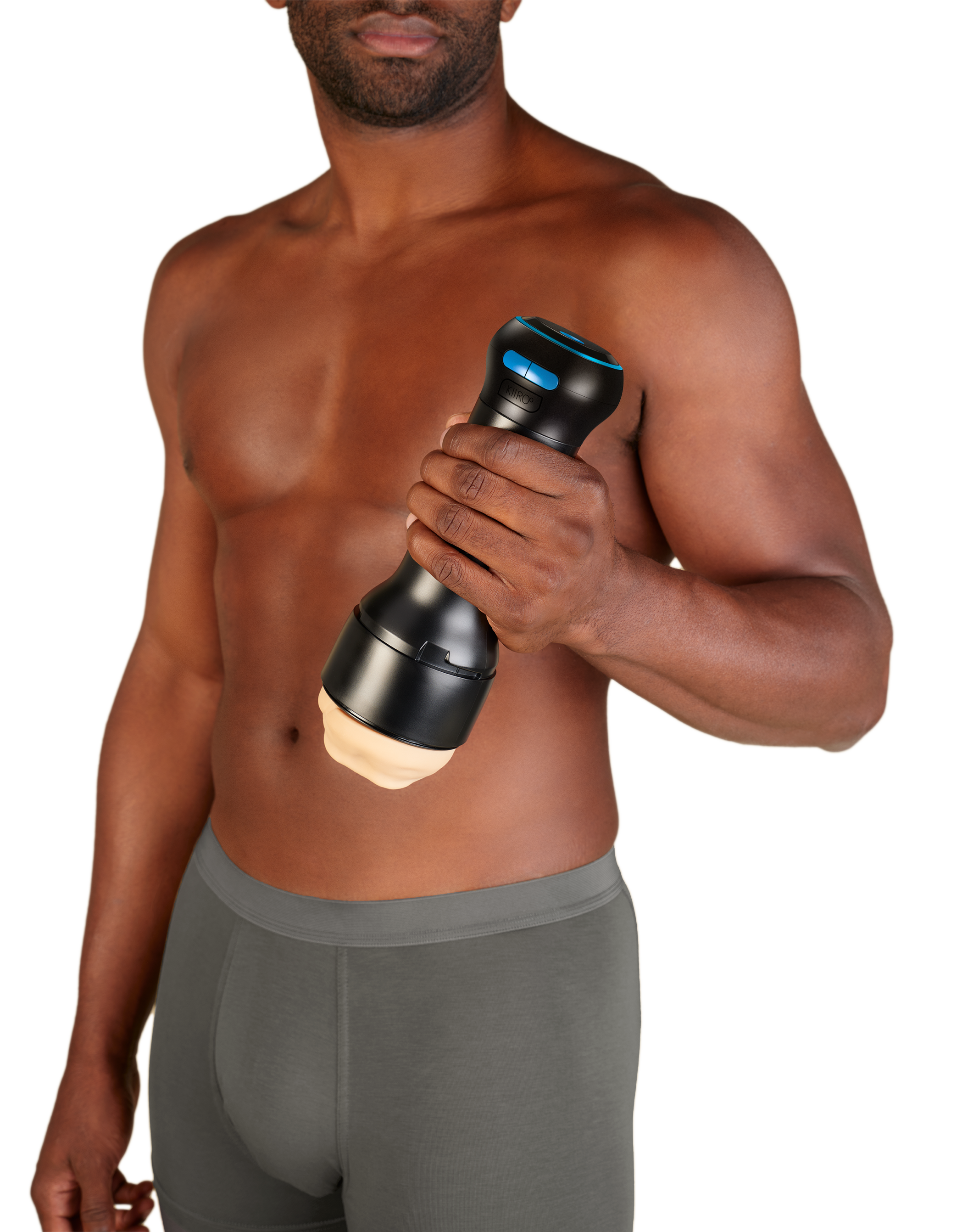 A man holds a black Kiiroo stroker controller with blue buttons.