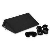 Black microfiber positioning wedge with cuffs and blindfold.