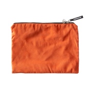 Orange microsuede travel pouch with zipper and "Liberator" tag.