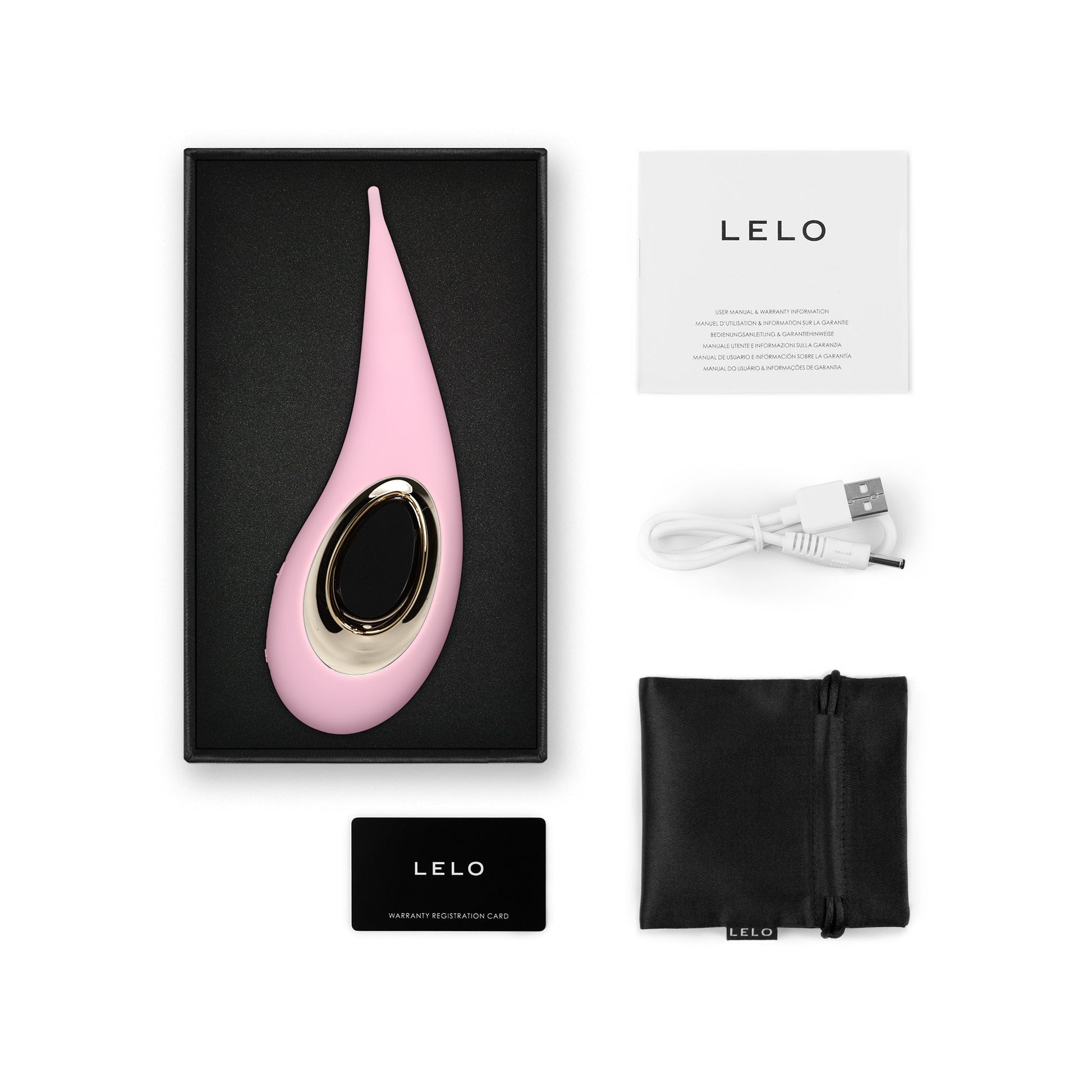Pink elliptical clitoral stimulator with gold accent, charging cable, manual, and pouch.