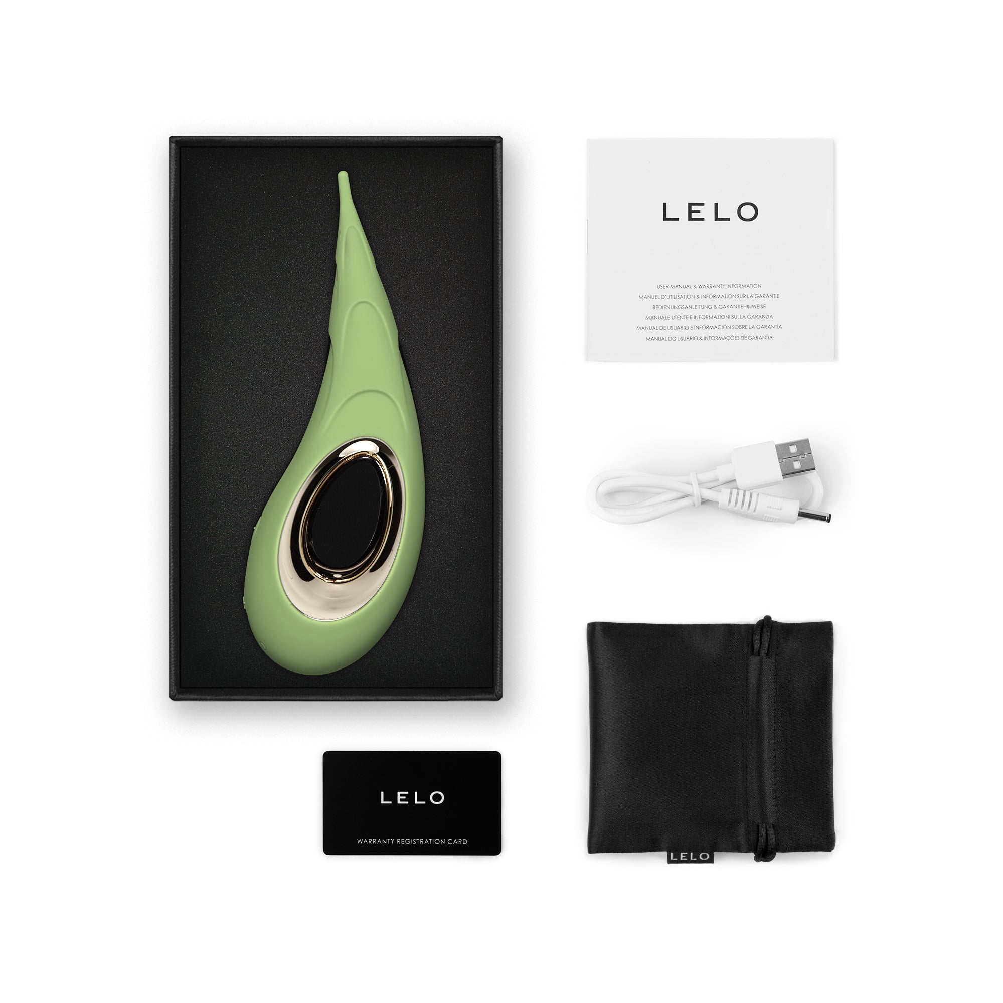 A green LELO DOT Cruise vibrator with a USB cable and manual.