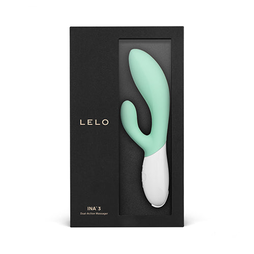 A mint green and white Lelo Ina 3 dual-action massager in a black box.