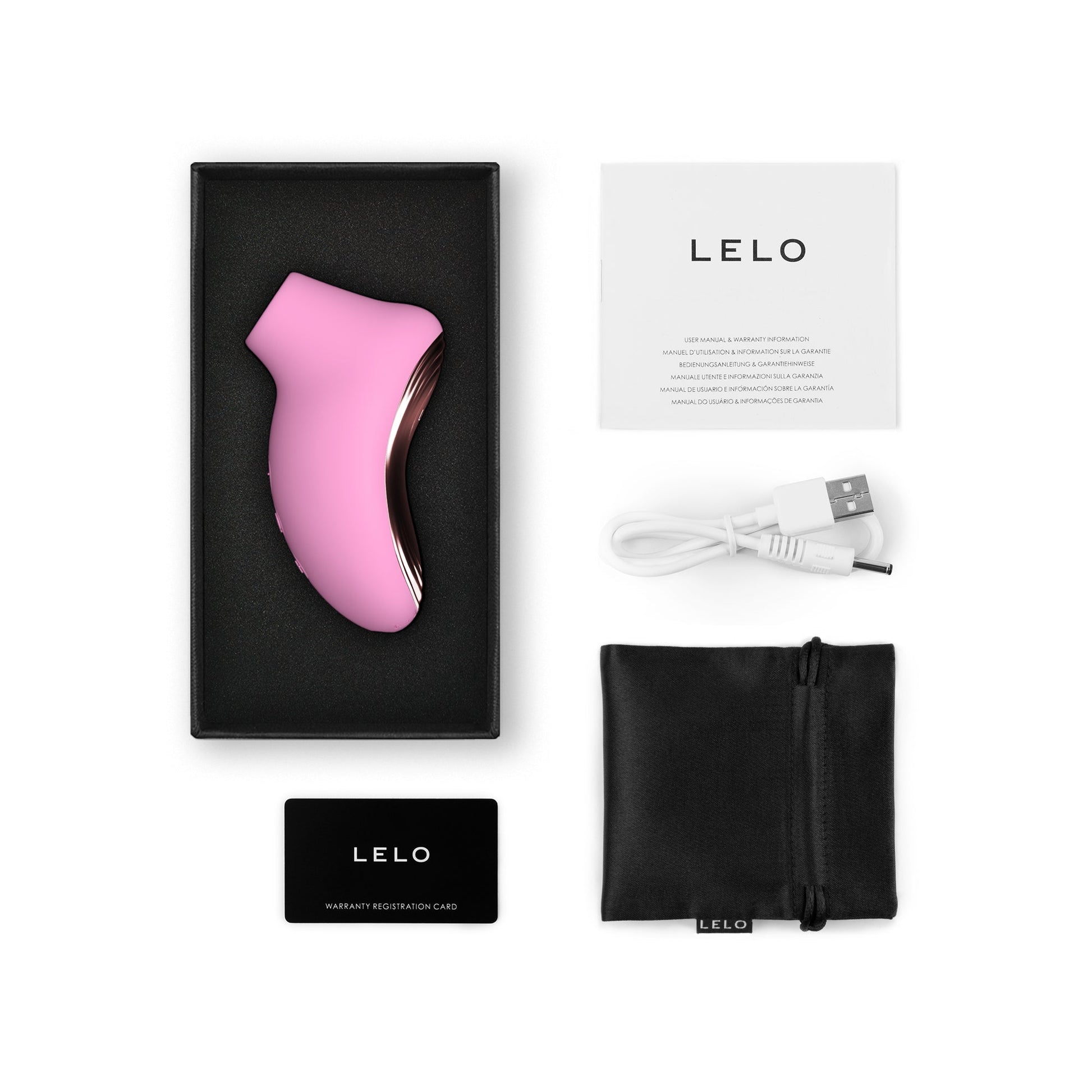 Pink silicone Lelo sonic clitoral stimulator with charging cable and manual.
