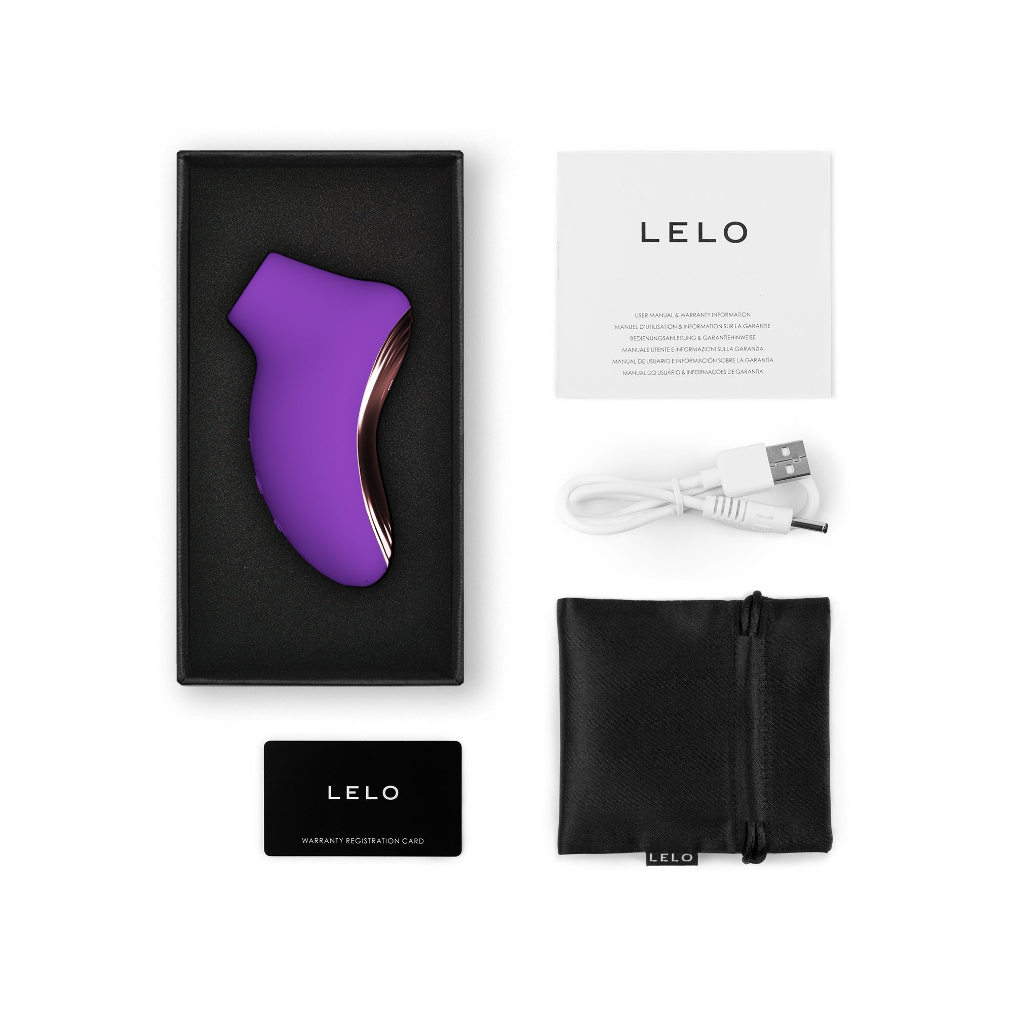 Purple silicone clitoral stimulator with charging cable, pouch, and manual.