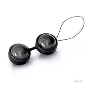 Two black silicone Kegel exercise beads with a string loop.