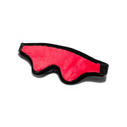 Red plush sensory blindfold with black trim and an adjustable strap.