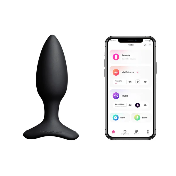 A black Lovense Hush 2 app-controlled vibrating butt plug next to a smartphone displaying the Lovense app.