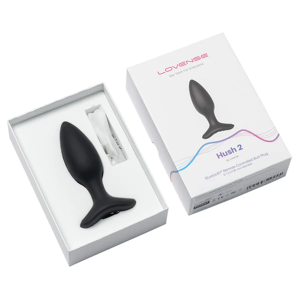 A black Lovense Hush 2 vibrating butt plug in its packaging.