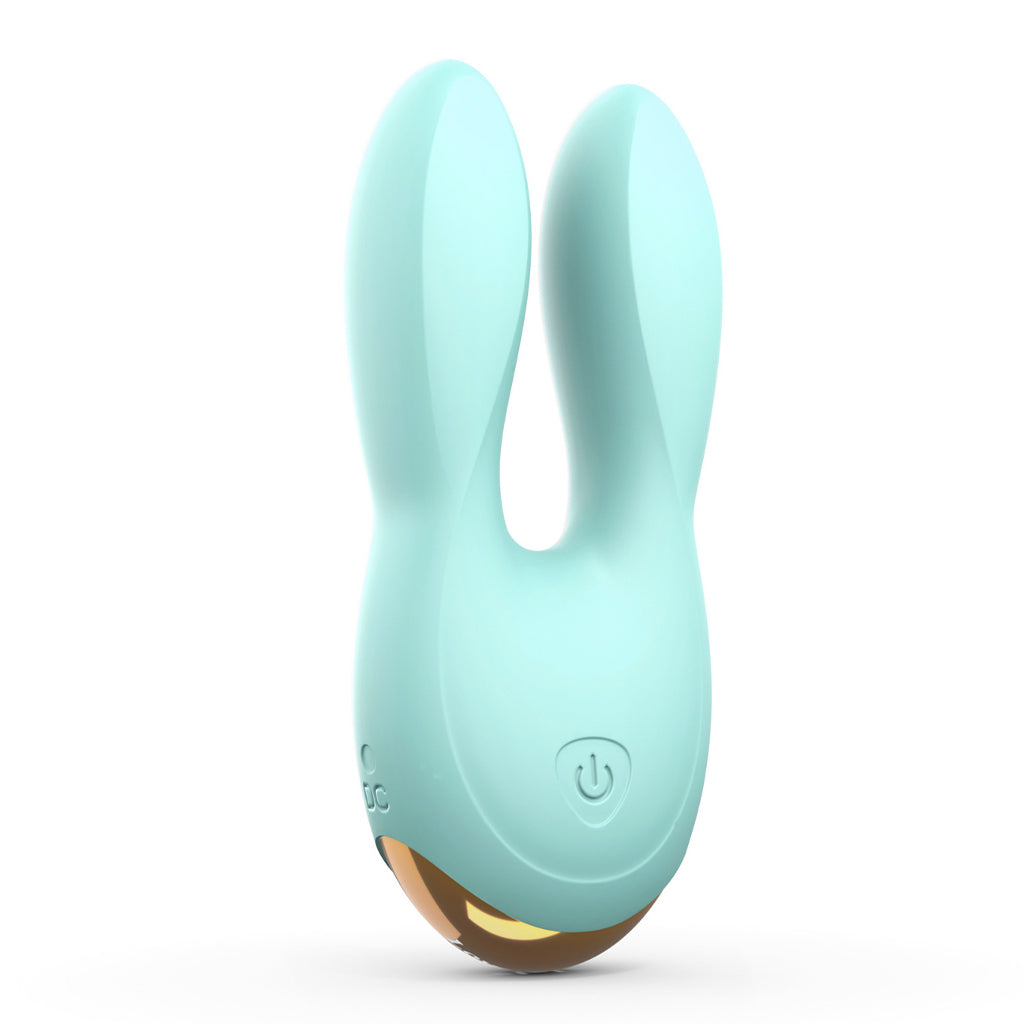 Mint green dual motor silicone clitoral vibrator with ear-shaped stimulators.