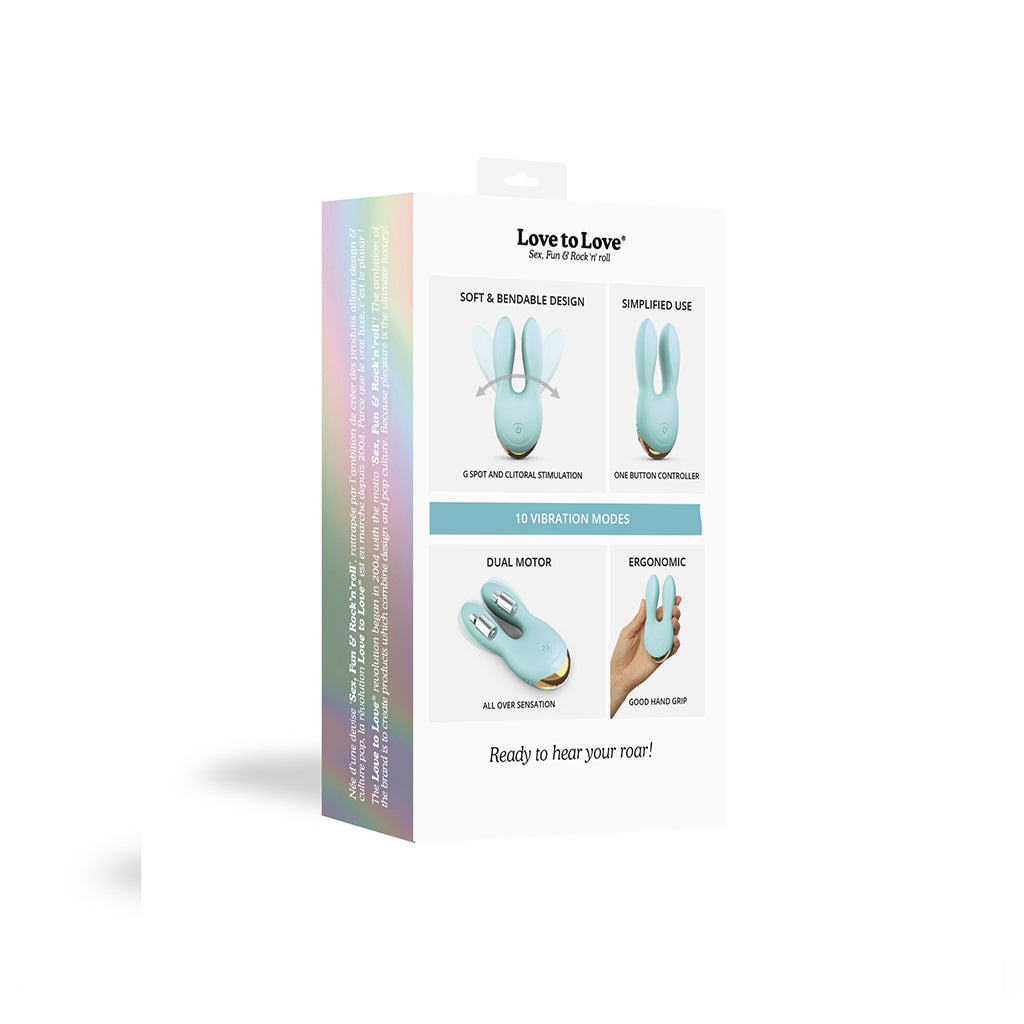 Mint green dual motor silicone clitoral vibrator with bendable ears.