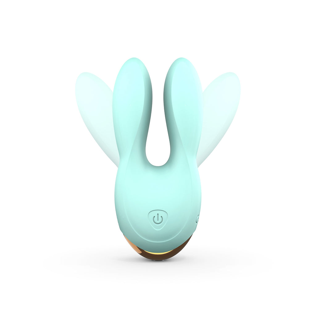 Mint dual motor silicone clitoral vibrator with bunny ears.