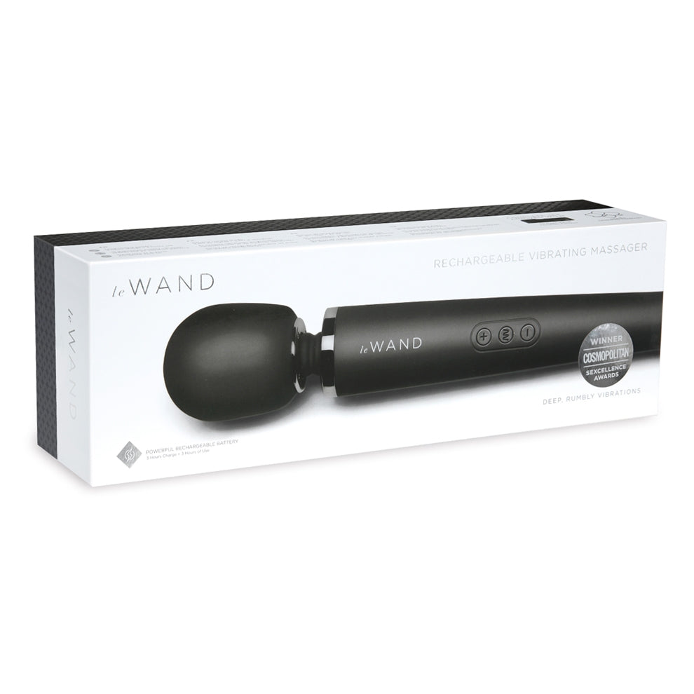A black Le Wand rechargeable vibrating massager on its packaging.