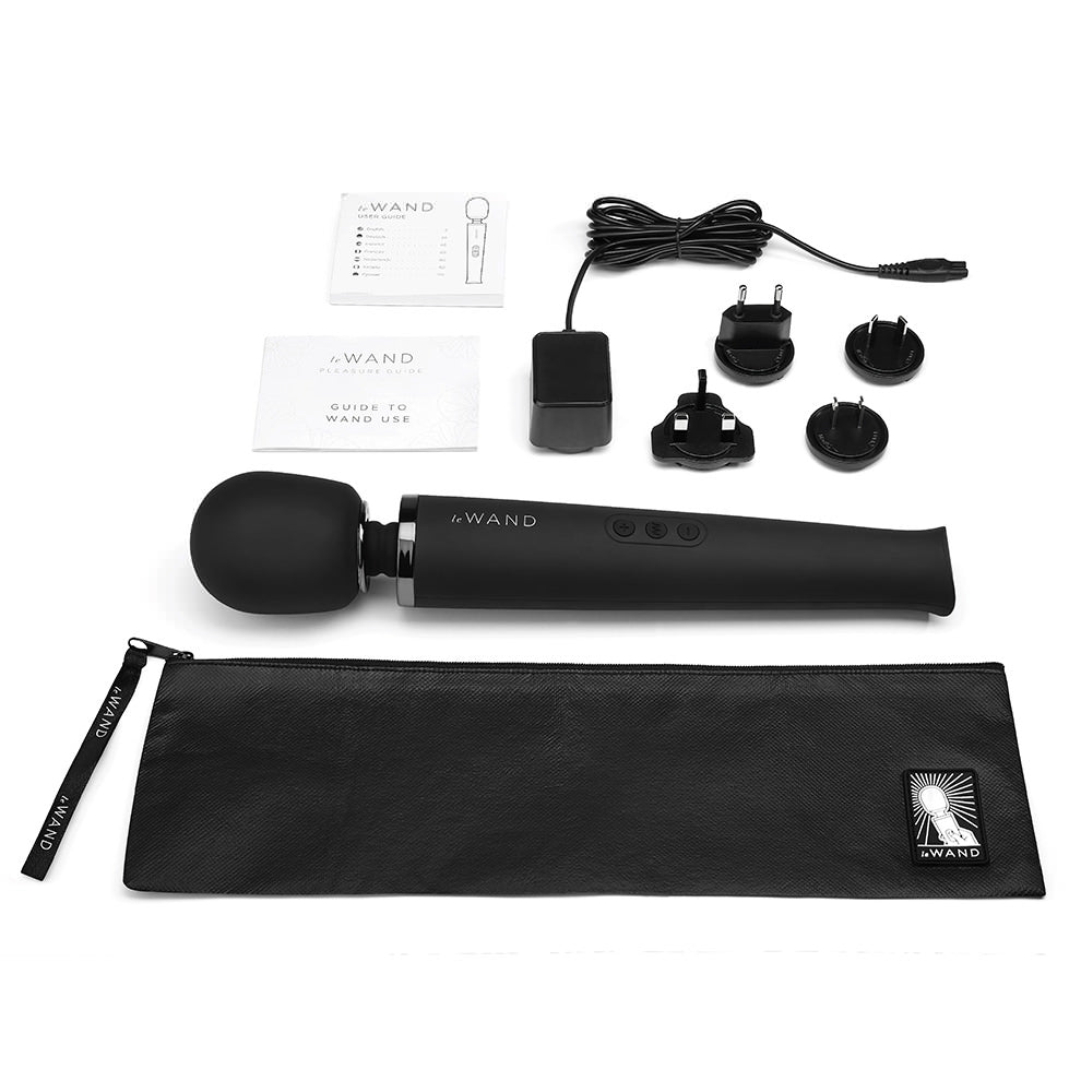 A black rechargeable wand massager with accessories and a travel case.