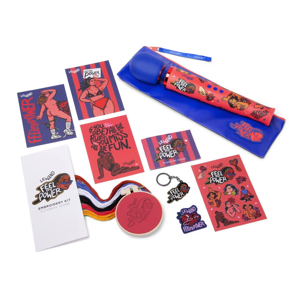 A red wand vibrator with a blue pouch and various empowerment-themed accessories.