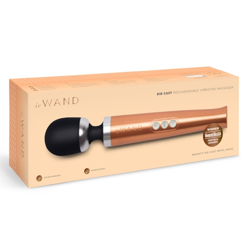 Rose gold die cast rechargeable wand massager with three buttons and a black head.