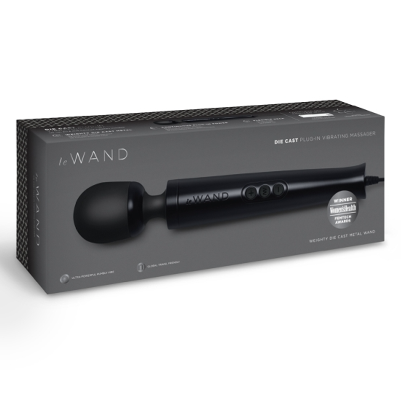 A black Le Wand die cast plug-in massager with a metal body on its packaging.
