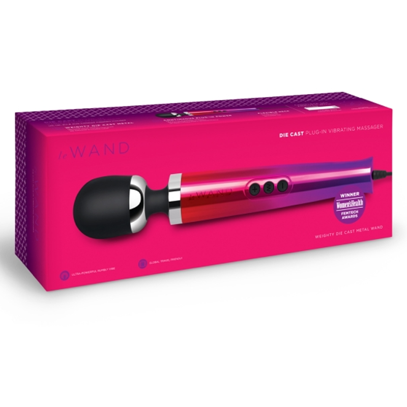 A Le Wand die cast plug-in vibrating massager in a pink and purple gradient on its box.