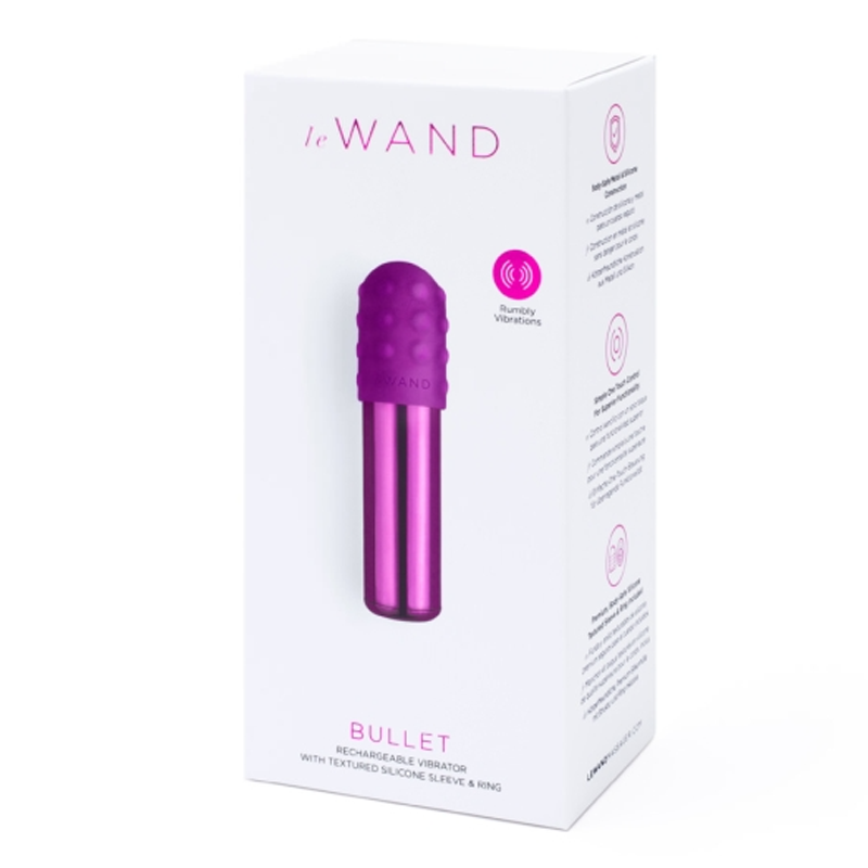 A purple bullet vibrator with a textured head on its packaging.