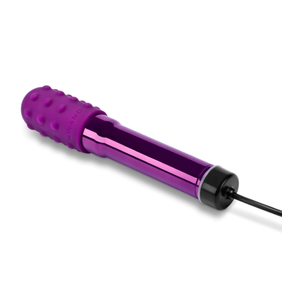 A purple rechargeable vibrator with a textured head and a charging cord.