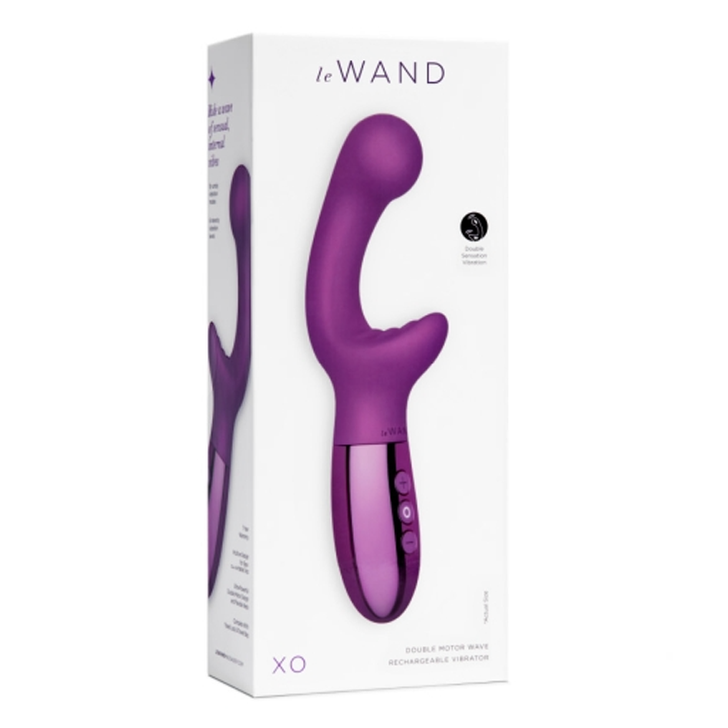 A purple Le Wand XO vibrator with a metallic base on its packaging.