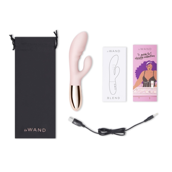 Rose gold rabbit vibrator with charging cable and product literature.