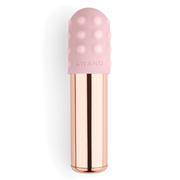 A rose gold bullet vibrator with a pink textured head.