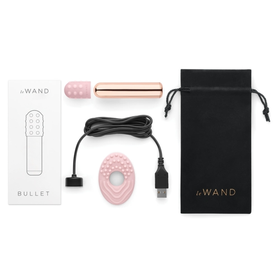 Rose gold bullet vibrator with charging cable, pink textured attachment, and black storage bag.