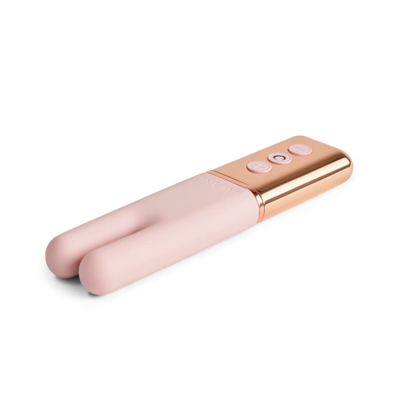 A pink silicone vibe with rose gold accents and three buttons.