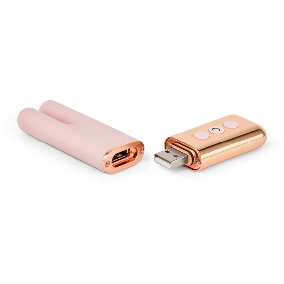 Rose gold and pink USB rechargeable mini vibe with dual prongs.