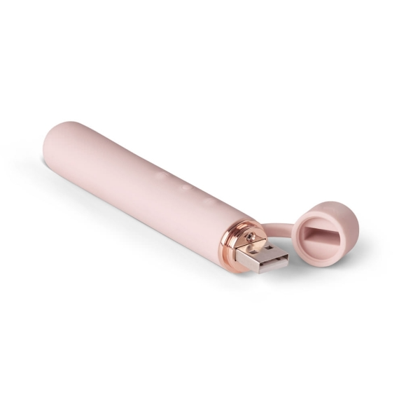 A pink USB vibrator with a rose gold accent and detached cap.
