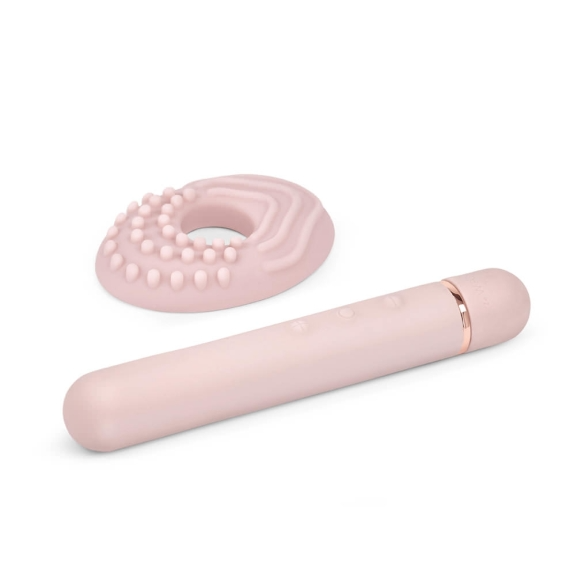 A pink vibrator with a textured ring and rose gold accents.