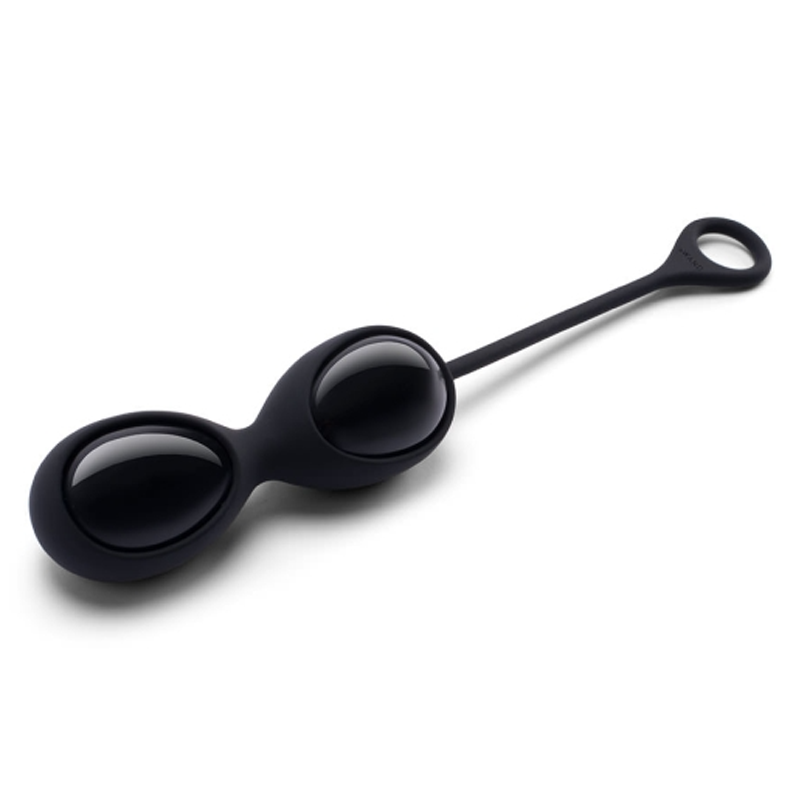 Black obsidian yoni eggs with a retrieval loop on a white background.