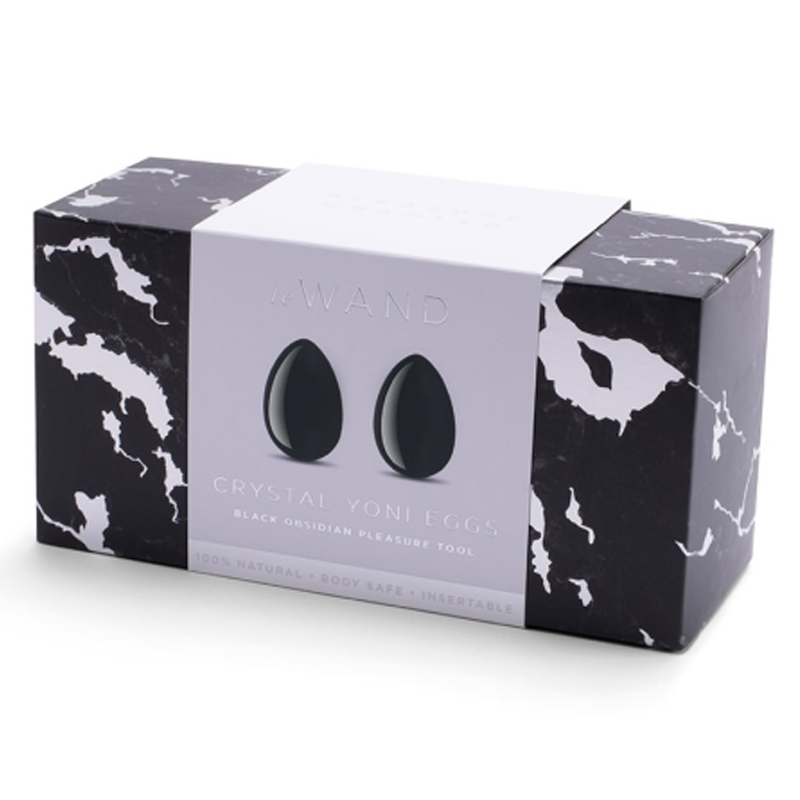 Le Wand Black Obsidian Crystal Yoni Eggs in a marble-patterned box.