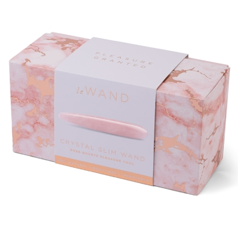 A pink rose quartz crystal slim wand in a marble patterned box.
