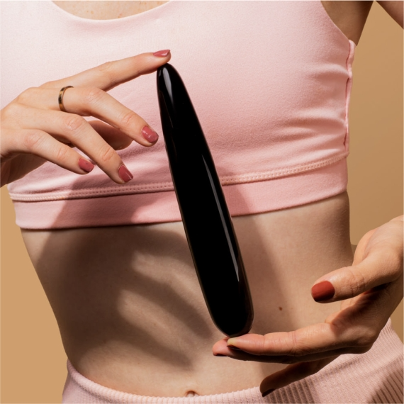 Black obsidian crystal slim wand massager with a pointed tip.