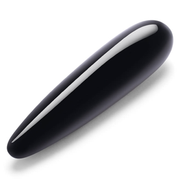 A smooth, black obsidian crystal wand with a tapered tip.