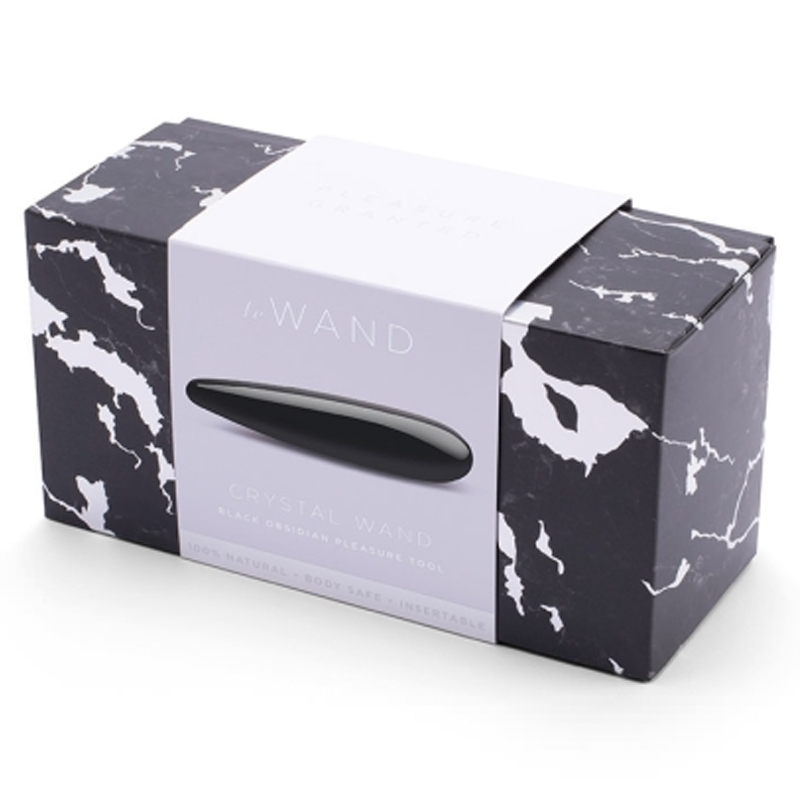 A black obsidian crystal wand in its packaging.