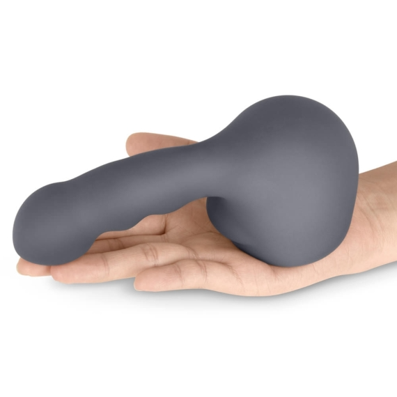 A grey silicone wand attachment with a curved shaft and bulbous head rests on a palm.