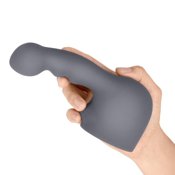 A grey silicone wand attachment held in a hand.