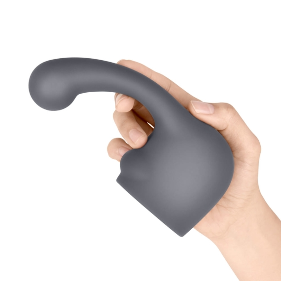 A grey silicone wand attachment with a curved tip held in a hand.